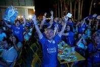 Leicester City fans celebrate after their team scores against Manchester United while watching the game on a big screen, in Bangkok, Thailand, May 1, 2016. REUTERS/Jorge Silva