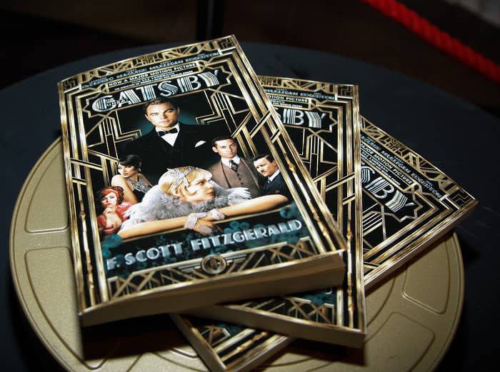 Three copies of the book The Great Gatsby with covers featuring the movie's stars