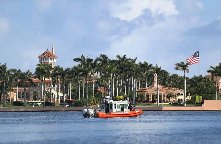 A US Coast Guard boat passes in front of Donald Trump's Mar-a-Lago estate, where the new US president has conducted important affairs of state