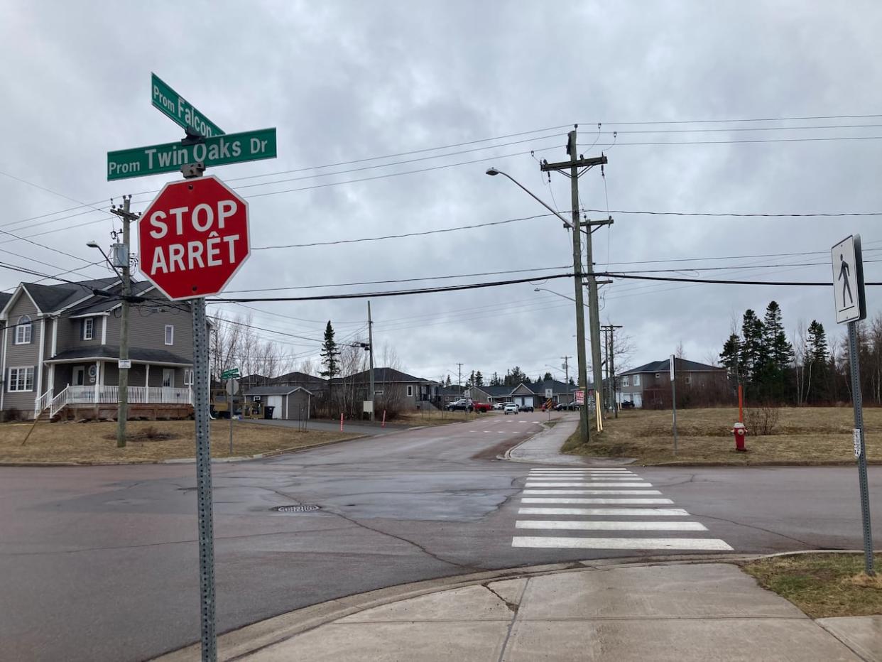A student on a bike was struck at the intersection of Twin Oaks Drive and Falcon Drive in Moncton's north end on Friday morning. (Mariam Mesbah/CBC - image credit)