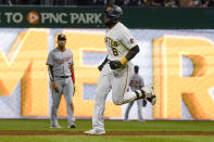 Pittsburgh Pirates' Anthony Alford (6) runs the bases in front of Washington Nationals second basemen Luis Garcia after hitting a solo home run during the seventh inning of a baseball game Friday, Sept. 10, 2021, in Pittsburgh. (AP Photo/Keith Srakocic)