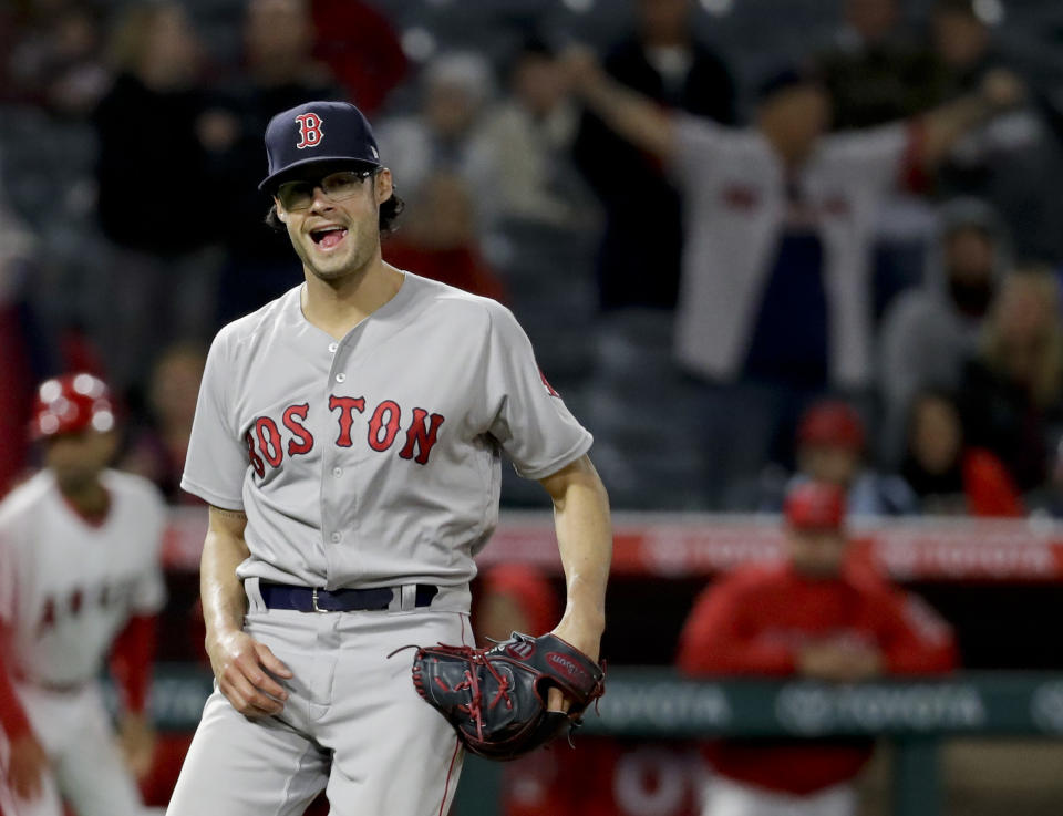 Boston Red Sox pitcher Joe Kelly celebrates the team’s 8-2 win over the Los Angeles Angels in a baseball game in Anaheim, Calif., Thursday, April 19, 2018. (AP Photo/Chris Carlson)