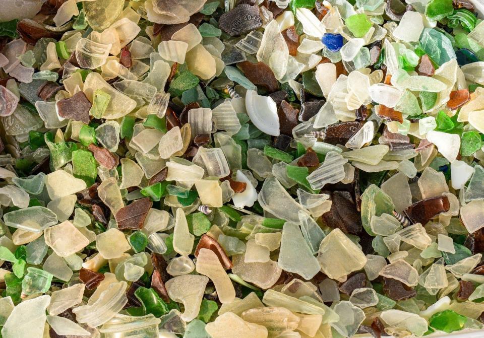 A large tub of beach glass sits at Debbie Prue’s home waiting to be sorted. Prue and her friend, Judy Porter, discovered the beach glass at what the call “secret beaches” on the Lake Erie Shore.