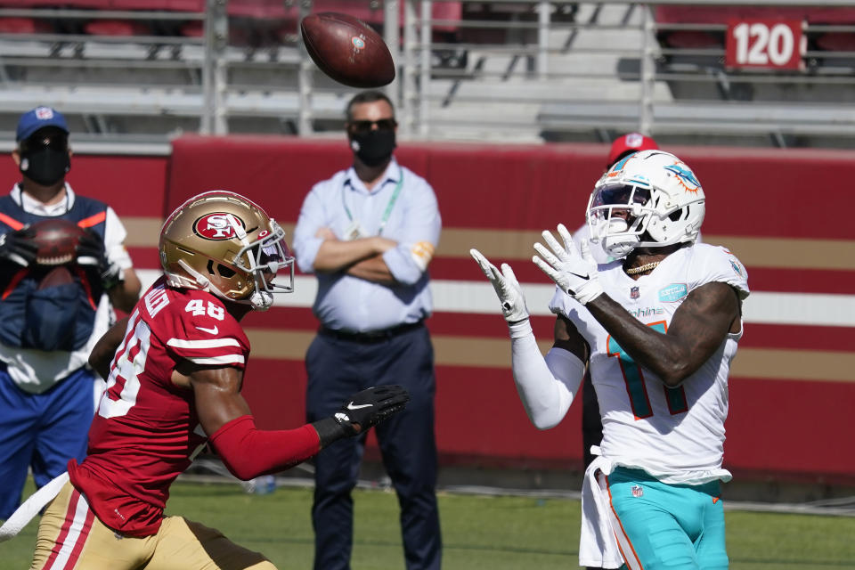 Miami Dolphins wide receiver DeVante Parker (11) catches a touchdown against San Francisco 49ers cornerback Brian Allen (48) during the first half of an NFL football game in Santa Clara, Calif., Sunday, Oct. 11, 2020. (AP Photo/Tony Avelar)