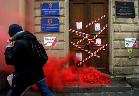 A protester walks away from the Roskomnadzor's office in central Saint Petersburg, Russia March 10, 2019. REUTERS/Anton Vaganov