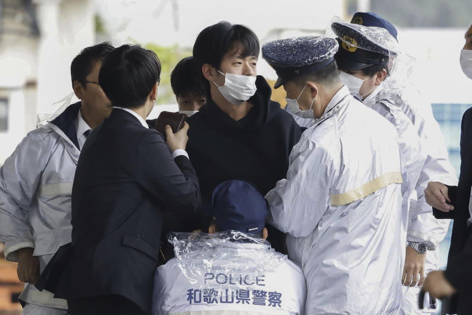 FILE - A man who was later identified as Ryuji Kimura is arrested after what appeared to be a pipe bomb was thrown at Japanese Prime Minister Fumio Kishida during his visit at a port in Wakayama, western Japan, Saturday, April 15, 2023. Kimura, who allegedly threw a pipe bomb at Kishida at a campaign venue, has complained about Japan’s election system and filed a damages suit against the government and criticized the prime minister, according to media reports and his possible social media postings. (Kyodo News via AP, File)