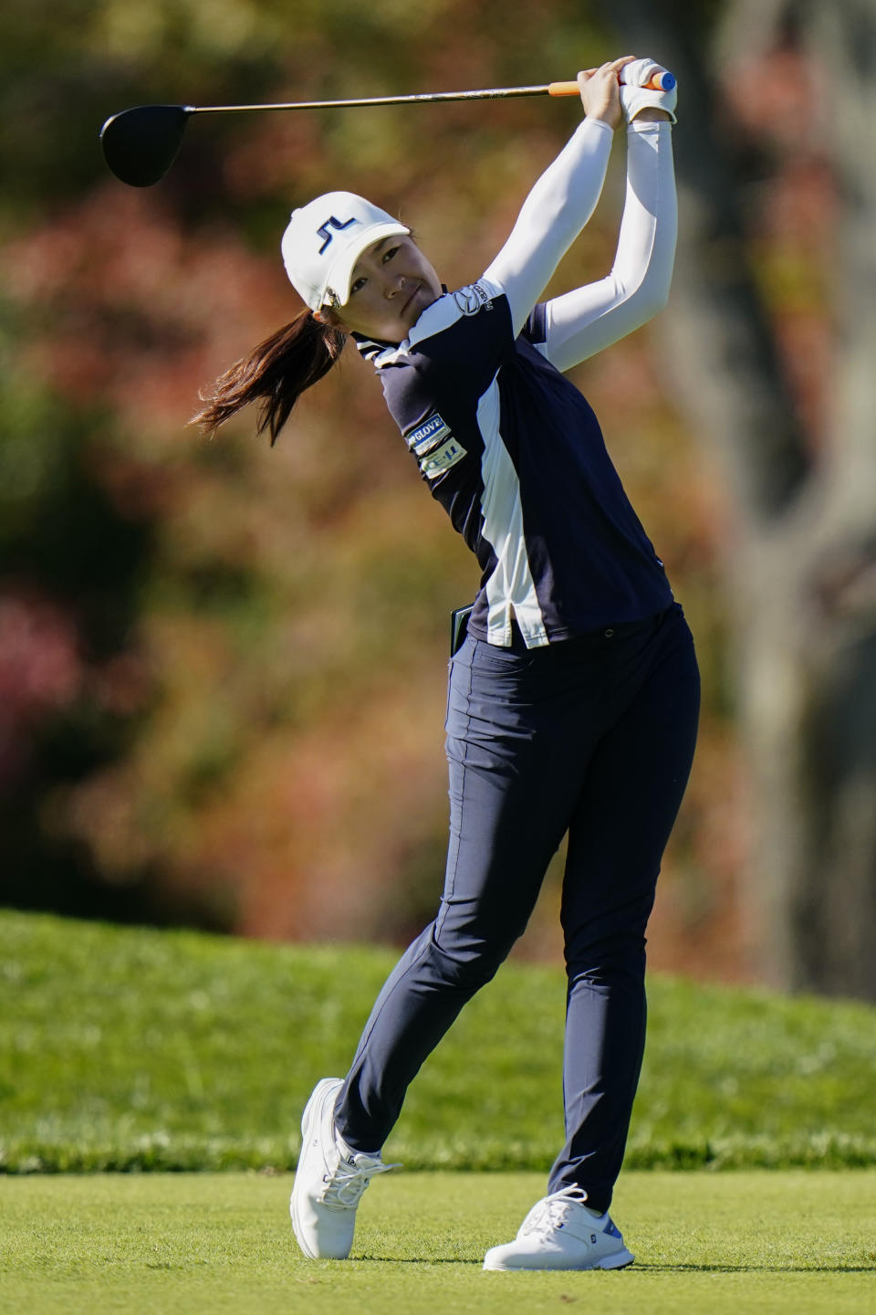 Kelly Tan, of Malaysia, hits her tee shot on the second hole during the first round of the KPMG Women's PGA Championship golf tournament at the Aronimink Golf Club, Thursday, Oct. 8, 2020, in Newtown Square, Pa. (AP Photo/Matt Slocum)