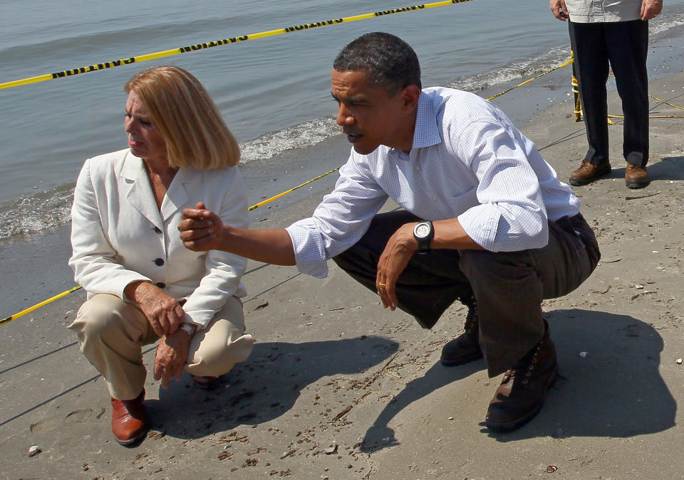 President Barack Obama (R) tours the beach at Port Fourchon with Parish President Charlotte Randolph May 28, 2010 in Port Fourchon, Louisiana. The oil spill resulting from the Deepwater Horizon disaster now officially ranks as the worst in U.S. history. (Photo by Win McNamee/Getty Images)