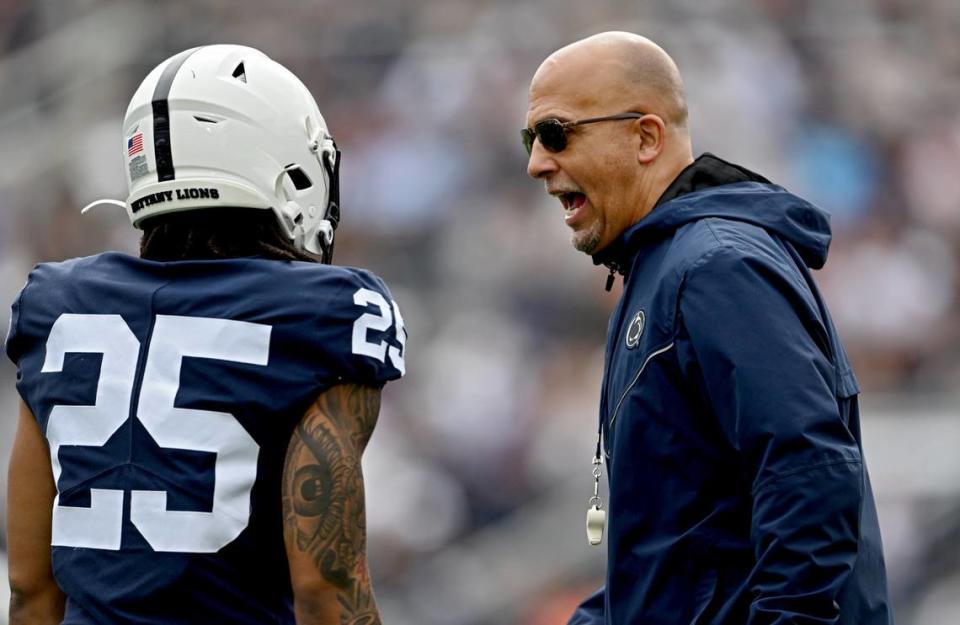 Penn State football coach James Franklin talks to Daequan Hardy during the Penn State Blue-White game on Saturday, April 15, 2023.