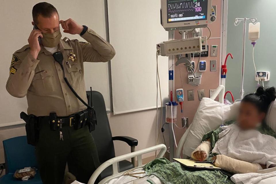 <div class="inline-image__caption"><p>Claudia Apolinar, who is unable to speak after the shooting, relays messages to a sheriff on the phone to President Donald Trump.</p></div> <div class="inline-image__credit">Los Angeles County Sheriff’s Department</div>