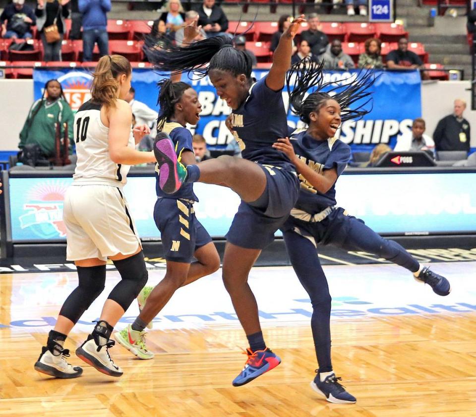 Miami High Darria Whitely (5) and Janay Quinn (12) celebrate as they defeat Plant HS in the 7A finals of the FHSAA Girl’s State Championships in Lakeland, Florida, February 29, 2020.