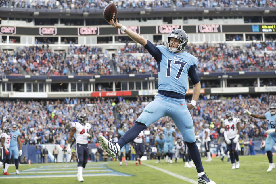 Tennessee Titans quarterback Ryan Tannehill (17) scores a touchdown on a 1-yard run against the Houston Texans in the second half of an NFL football game Sunday, Dec. 15, 2019, in Nashville, Tenn. (AP Photo/James Kenney)