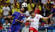 Soccer Football - World Cup - Group H - Poland vs Colombia - Kazan Arena, Kazan, Russia - June 24, 2018 Colombia's Juan Cuadrado in action with Poland's Maciej Rybus REUTERS/Sergio Perez