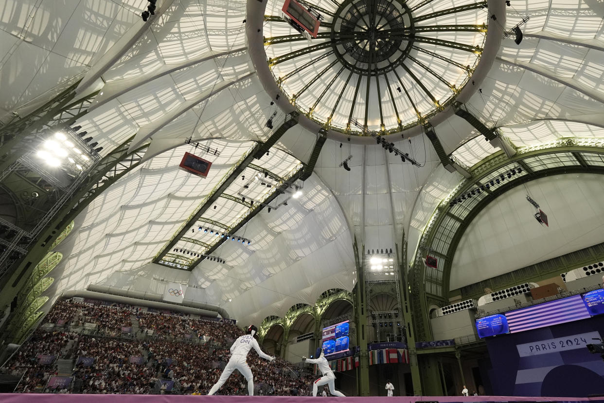 A view of the Grand Palais during the women's team Epee semifinal match between China and Italy at the 2024 Summer Olympics, Tuesday, July 30, 2024, in Paris, France. (AP Photo/Andrew Medichini)