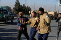 <p>A wounded security guard receives help after being rescued from Kabul’s Intercontinental Hotel during an attack by gunmen in Kabul, Afghanistan January 21, 2018. (Photo: Omar Sobhani/Reuters) </p>