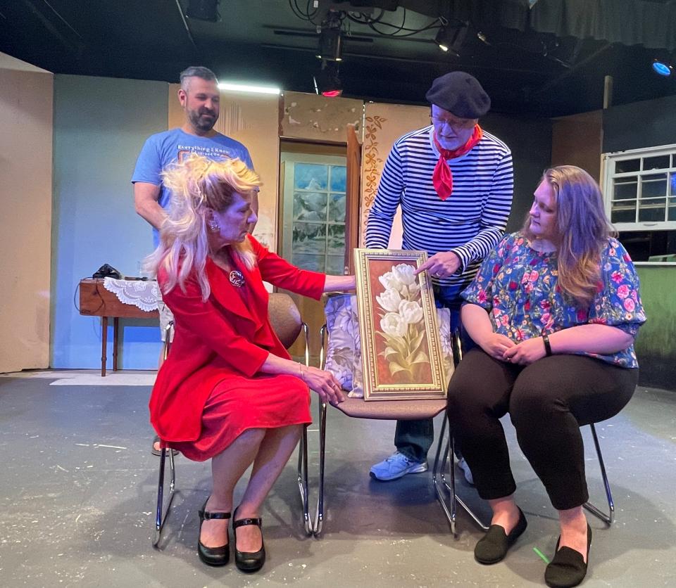 Standing, Josh Green, left, and Rick Henderson and, seated, Amy Johnson-Sobek, left, and Kaelie Winebrenner rehearse a scene for Footlight Players Theatre's production of "Murdered to Death" that opens May 5 and continues through May 14, 2023, at the community theater in Michigan City.