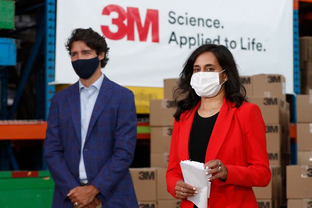 Minister of Public Services and Procurement Anita Anand and Prime Minister Justin Trudeau wear a mask during an announcement at the 3M plant in Brockville, Ont. on Aug 21, 2020.