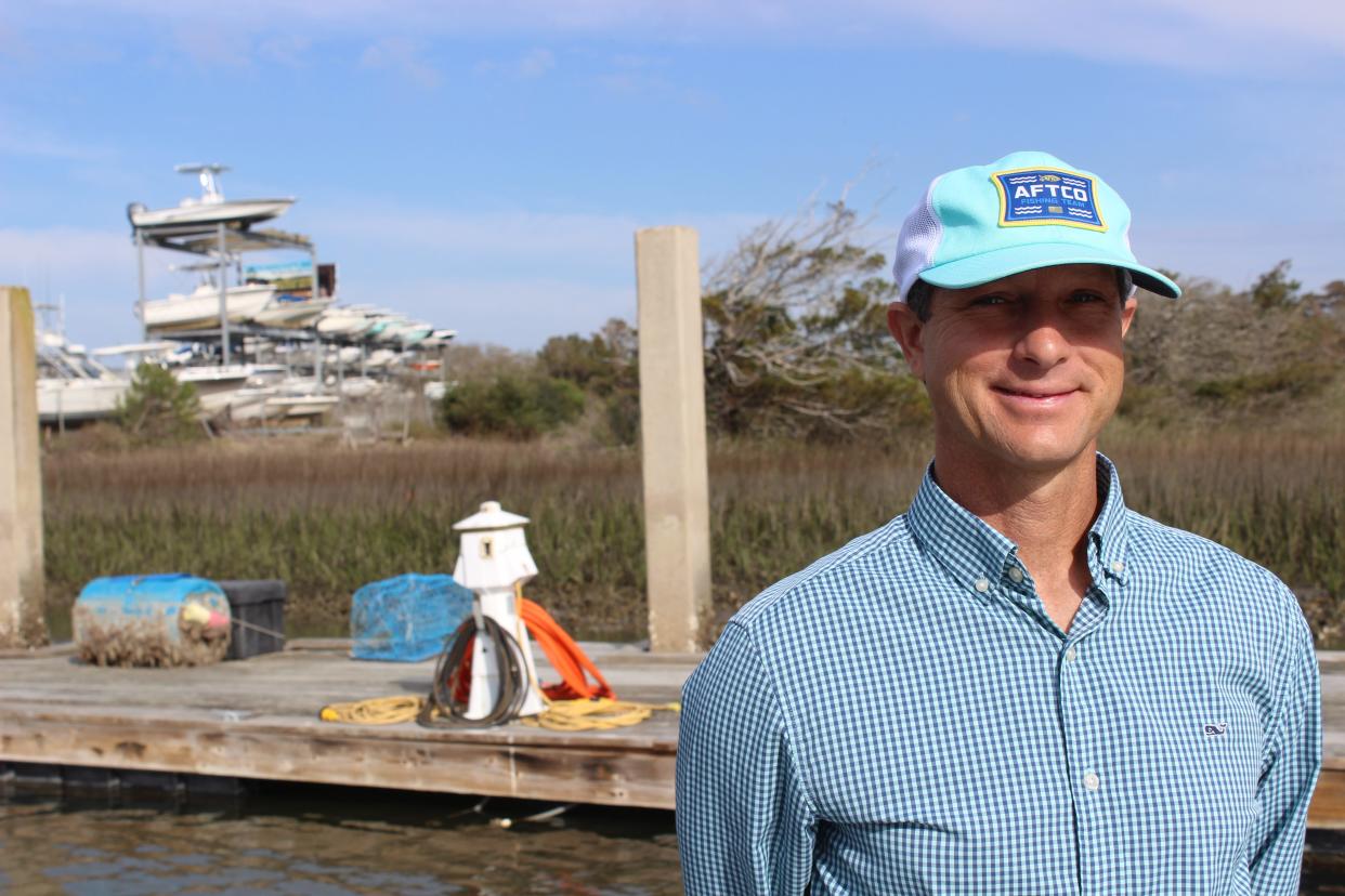 Cane Faircloth, president of the Lockwood Inlet Association, discusses the organization's recent proposal to build a jetty to maintain the inlet at the Holden Beach Marina on Friday, March 17, 2023.