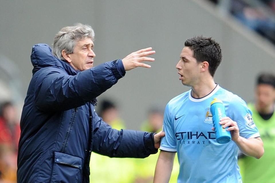 At the double: Nasri won the Premier League and league Cup under Pellegrini (Getty Images)