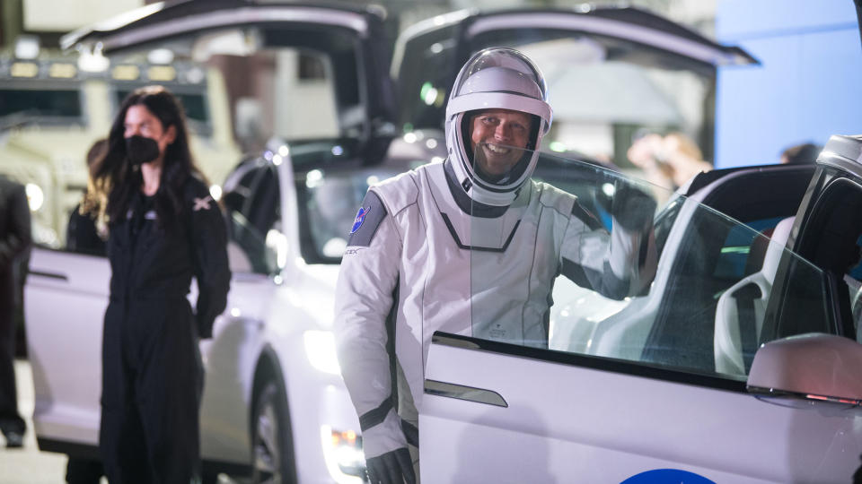 NASA astronaut Robert Hines waves to family and friends as he and crew mates NASA astronauts Kjell Lindgren, Jessica Watkins, and ESA (European Space Agency) astronaut Samantha Cristoforetti, wearing SpaceX spacesuits, depart the Neil A. Armstrong Operations and Checkout Building for Launch Complex 39A to board the SpaceX Crew Dragon spacecraft for the Crew-4 mission launch, Tuesday, April 26, 2022, at NASA’s Kennedy Space Center in Florida.