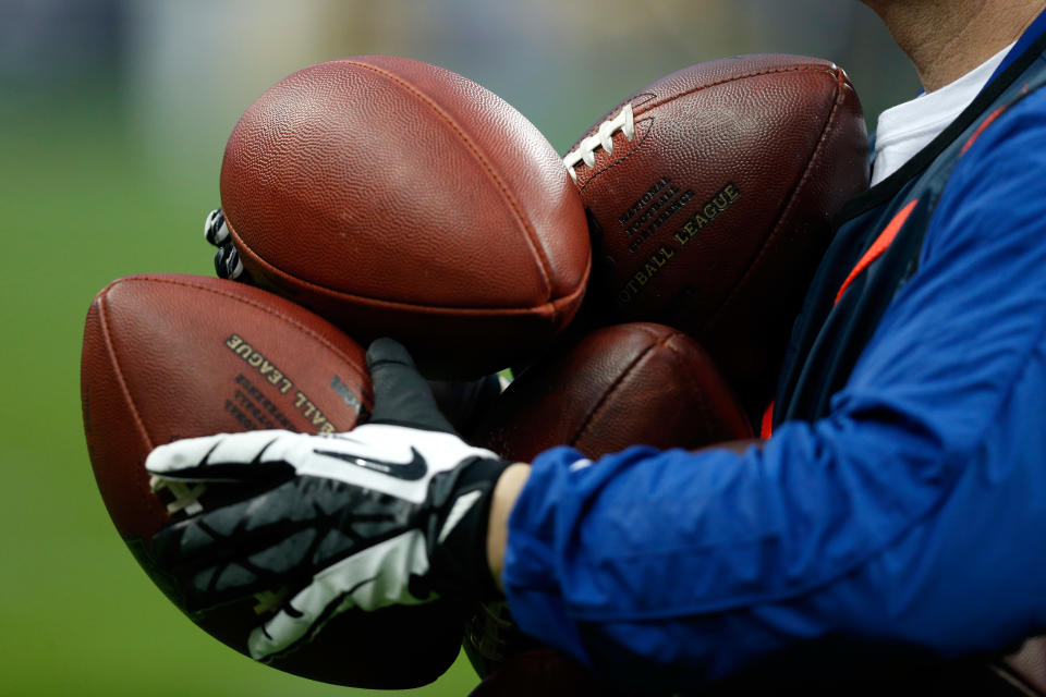 HOUSTON, TX - JANUARY 05:  A detail of an official holding footballs as the Cincinnati Bengals play against the Houston Texans during their AFC Wild Card Playoff Game at Reliant Stadium on January 5, 2013 in Houston, Texas.  (Photo by Scott Halleran/Getty Images)