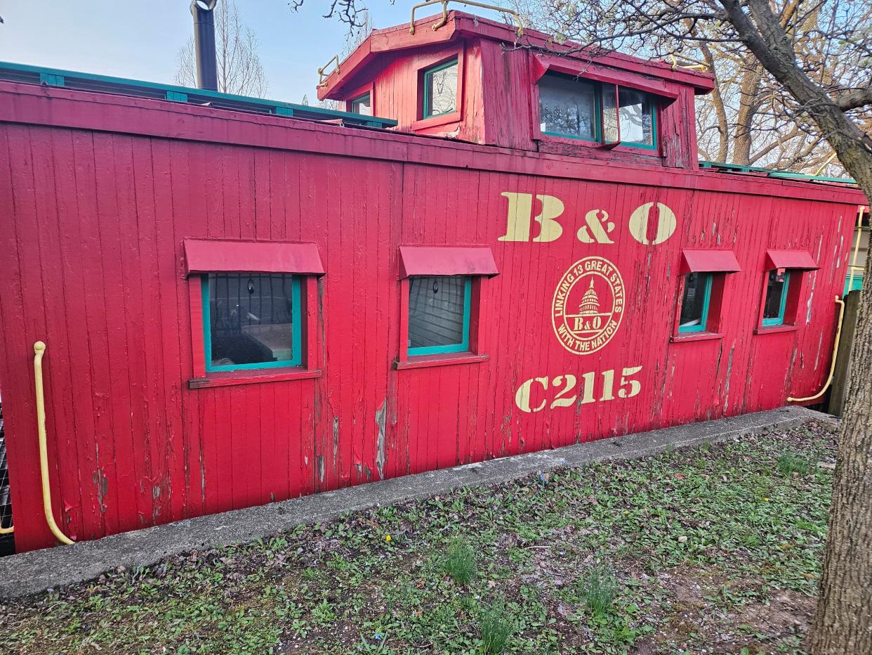 The red railroad museum cabooses sit at the entrance of Yoctangee Park. They hold the history of the railway in the area.