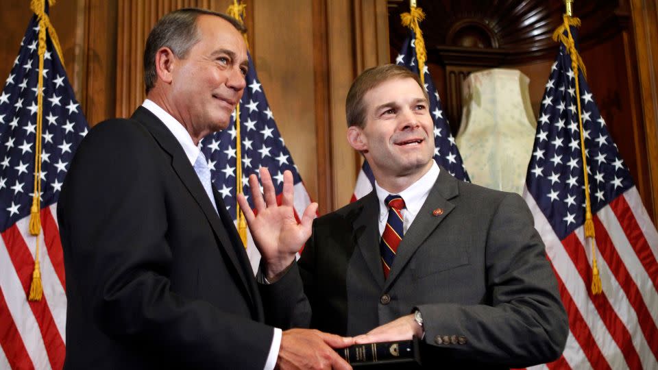 House Speaker John Boehner of Ohio participates in a ceremonial swearing in with Rep. Jim Jordan on Capitol Hill in 2011. - Jacquelyn Martin/AP