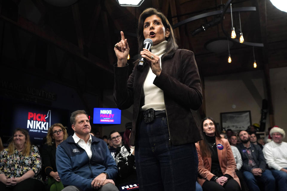 Republican presidential candidate Nikki Haley speaks at a town hall campaign event after receiving an endorsement from New Hampshire Gov. Chris Sununu, seated in the front row at left, Tuesday, Dec. 12, 2023, in Manchester, N.H. (AP Photo/Robert F. Bukaty)