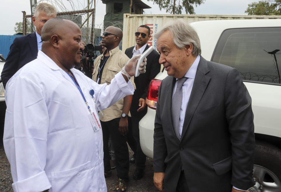 United Nations Secretary-General Antonio Guterres, right, has his temperature taken as a routine measure to stop the spread of Ebola, upon his arrival at the airport in Goma, eastern Congo Saturday, Aug. 31, 2019. Guterres is starting a three-day visit to Congo to see the work of UN peacekeepers, work on disarmament and reintegration of ex-combatants, and efforts to stop the spread of the Ebola virus. (AP Photo/Justin Kabumba)