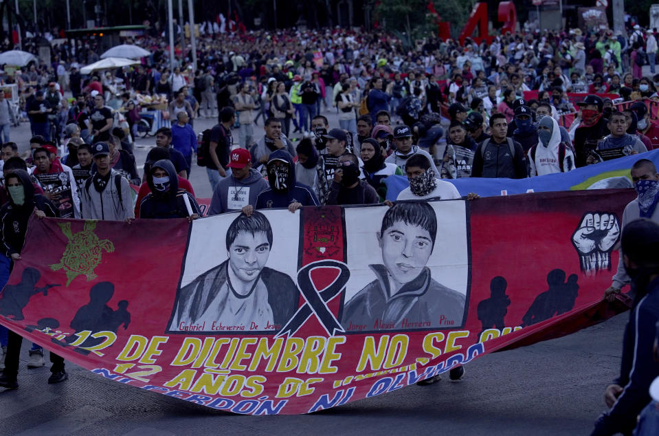 Relatives and sympathizers of 43 missing Ayotzinapa university students march on the 9th anniversary of their disappearance, in Mexico City, Tuesday, Sept. 26, 2023. (AP Photo/Marco Ugarte)