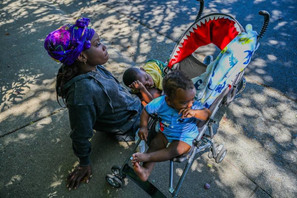 Brittany Anderson, 36, rests on a curb with sons Britain, 5, and Brandon, 9 months, in May. She was living in an overcrowded apartment and the owner had several dogs and she didn’t know how much longer she could remain there. Her son Britain had been expelled from school for missing too many days. “It could be detrimental to people who don’t have a good mindset,” she said about being homeless. “Especially those that have postpartum depression – it can take a really big toll on us.”