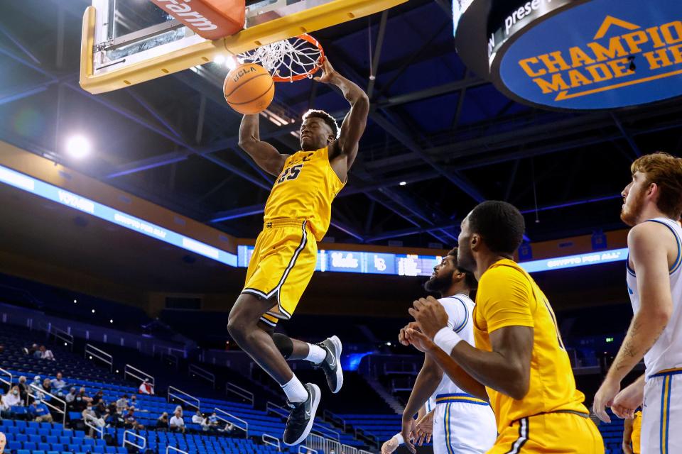 Long Beach State guard Aboubacar Traore (25) dunks against UCLA during the second half of an NCAA college basketball game Thursday, Jan. 6, 2022, in Los Angeles. UCLA won 96-78. (AP Photo/Ringo H.W. Chiu)