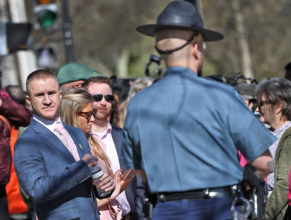 Aidan Kearney, the blogger behind the "Turtleboy" website, waits to see if her can get a seat in the courtroom as jury selection begins in the Karen Read murder trial in Norfolk Superior Court in Dedham on Tuesday, April 16, 2024.