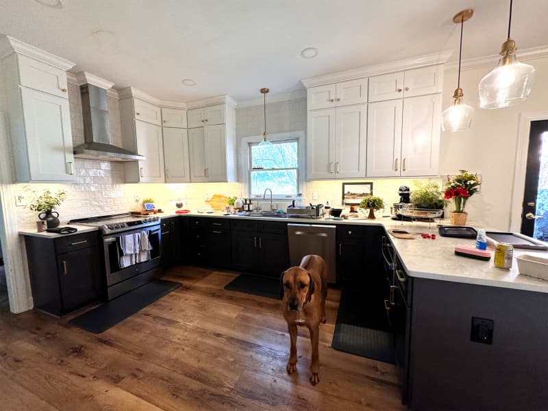 Messy countertops in kitchen before using one hour cleaning method.