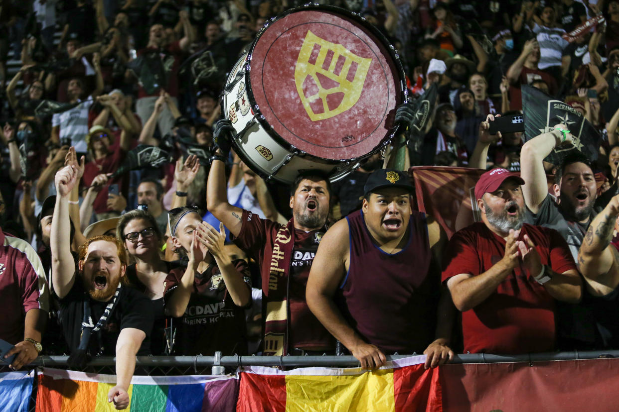 SACRAMENTO, CA - JULY 27: Sacramento Republic FC fans in their supporters group, the Tower Bridge Battalion, celebrate their victory after a U.S. Open Cup Semifinal game between Sporting Kansas City and Sacramento Republic FC at , California. (Photo by Erin Chang/ISI Photos/Getty Images)