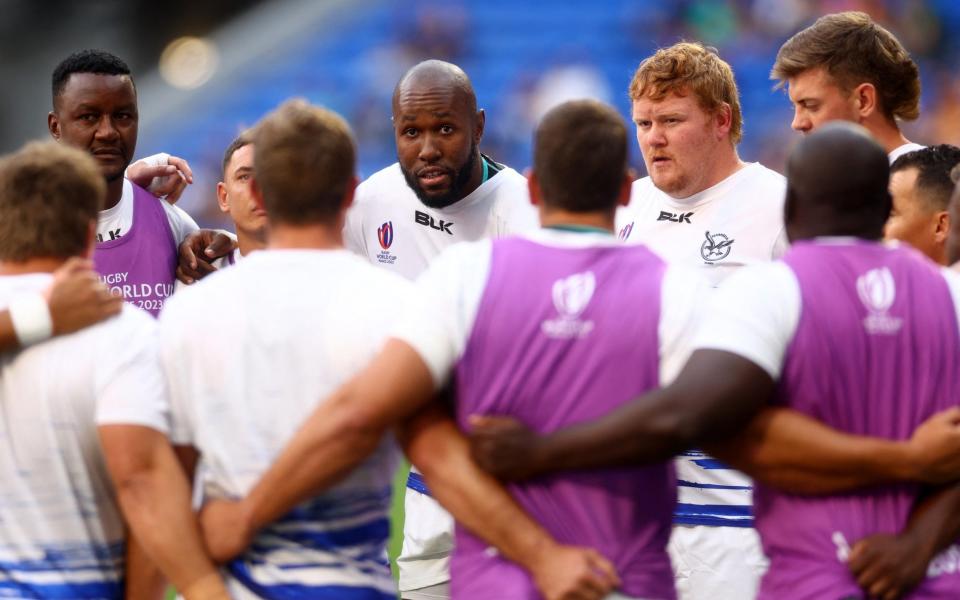 Namibia's Tjiuee Uanivi speaks to his teammates during the warm up before the match