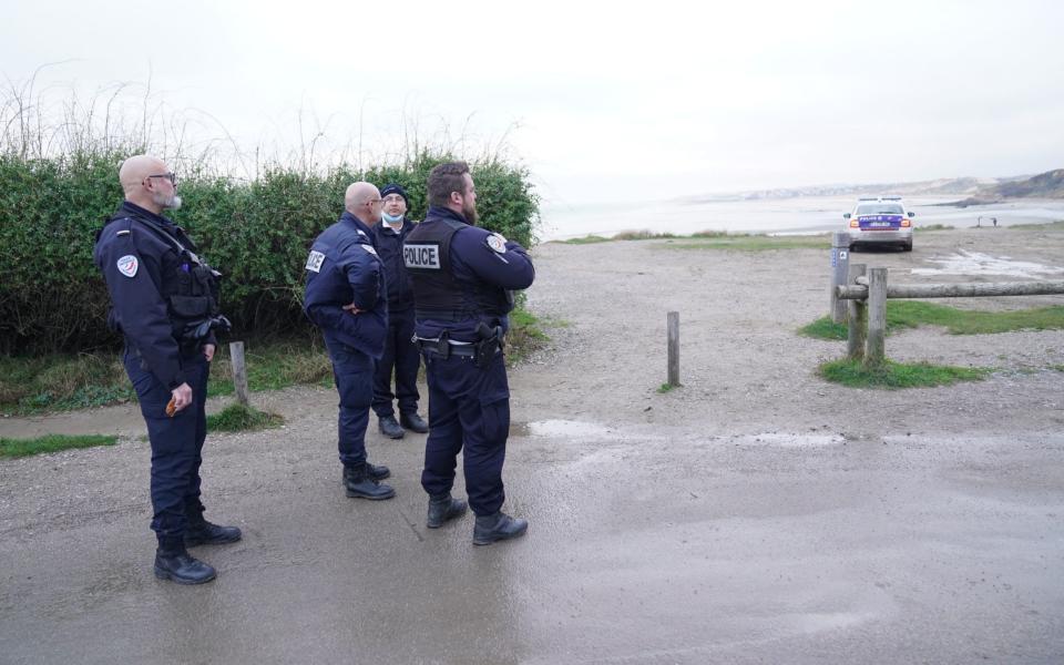 French police looking over the coast at Wimereux, a stretch of land believed to be used for Channel crossings - Stefan Rousseau/PA Wire