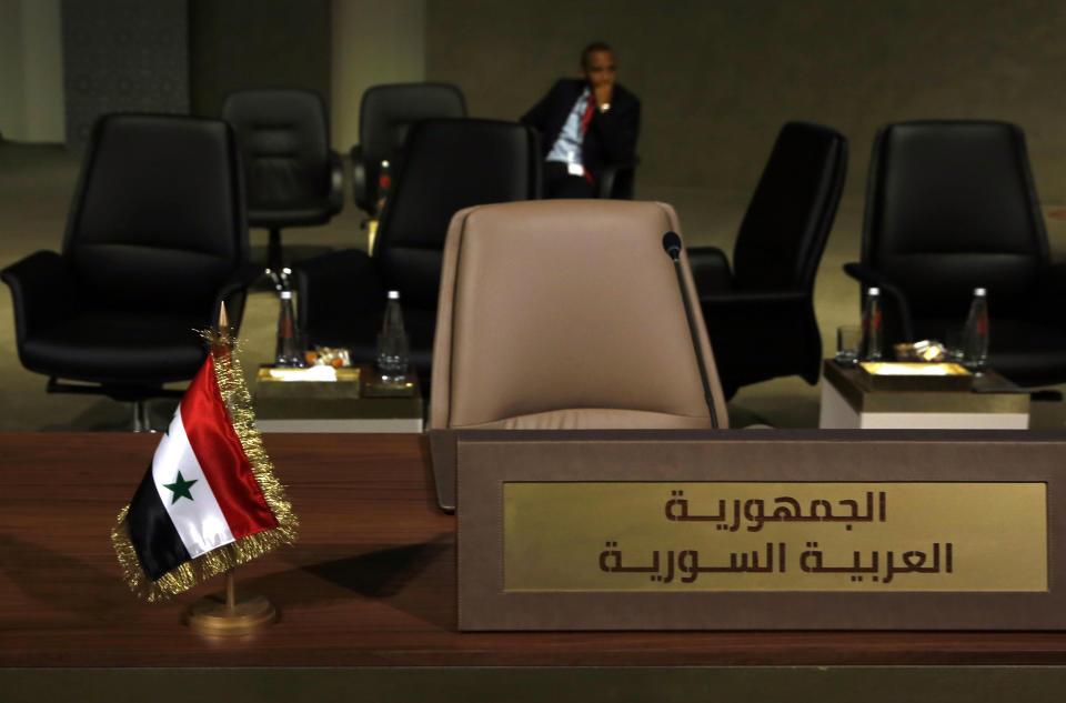 The chairs of the delegation from Syria are empty at the Arab Economic and Social Development Summit, in Beirut, Lebanon, Sunday, Jan. 20, 2019. Lebanon used the summit Sunday to call for the start of return of Syrian refugees to safe areas in their war-torn country even before a solution is reached to end the nearly eight-year-old crisis that killed nearly half a million people. (AP Photo/Bilal Hussein)