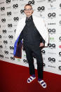 <p>The designer shows off his eccentric style in white sandals and purple socks at the <i>GQ</i> Men of the Year Awards 2016 in Germany. <i> (Photo: Franziska Krug/Getty Images for GQ) </i> </p>