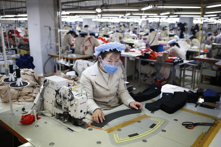 North Korean workers sew clothes in a factory owned by a South Korean company at the Joint Industrial Park in Kaesong just a few hundred metres north of the demilitarized zone that separates the two Koreas