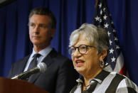 FILE - In this Sept. 18, 2019, file photo, California Air Resources Board Chair Mary Nichols, with California Gov. Gavin Newsom at left, discusses the Trump administration's pledge to revoke California's authority to set vehicle emissions standards that are different than the federal standards, during a news conference in Sacramento, Calif. Nichols' term leading the state ARB ends in December 2020. She's held the role since 2007 after an earlier stint as chair in the early 1980s. (AP Photo/Rich Pedroncelli, File)