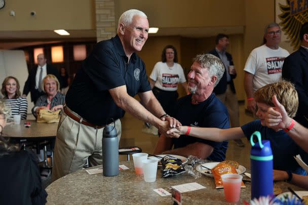 PHOTO: Former Vice President Mike Pence greets guests at the Bremer County Republicans' Grill and Chill lunch, Aug. 20, 2022, in Waverly, Iowa. (Scott Olson/Getty Images)