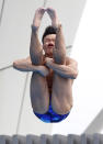 "Deeeep breaths." China's He Min dives during the men's 1-meter Springboard final at the FINA Swimming World Championships in Shanghai, China, Monday, July 18, 2011. (AP Photo/Wong Maye-E)