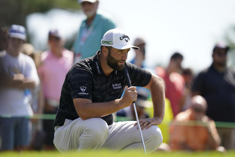 Jon Rahm of Spain, lines up his shot on the first green during the third round of the Tour Championship golf tournament Saturday, Sept. 4, 2021, at East Lake Golf Club in Atlanta. (AP Photo/Brynn Anderson)