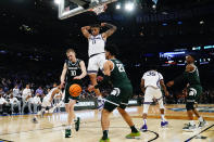 Kansas State forward Keyontae Johnson (11) dunks in the second half of a Sweet 16 college basketball game against Michigan State in the East Regional of the NCAA tournament at Madison Square Garden, Thursday, March 23, 2023, in New York. (AP Photo/Frank Franklin II)