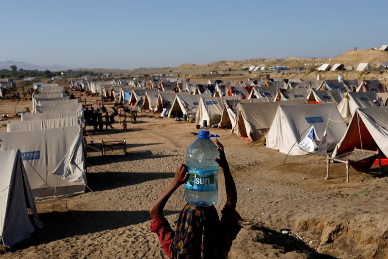 FILE PHOTO: People displaced because of the floods take refuge in a camp, in Sehwan