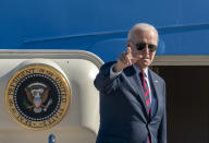President Joe Biden gestures as he boards Air Force One for a trip to New Hampshire to promote his economic agenda, Tuesday, Nov. 16, 2021, at Andrews Air Force Base, Md. (AP Photo/Gemunu Amarasinghe)