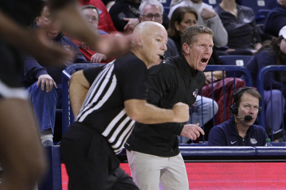 Gonzaga head coach Mark Few, right, shouts to players during the first half of the team's NCAA college basketball game against Portland, Saturday, Jan. 14, 2023, in Spokane, Wash. (AP Photo/Young Kwak)
