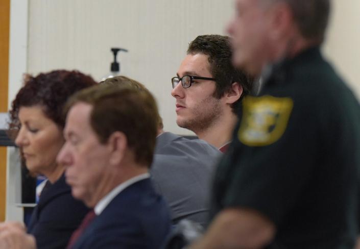 Austin Harrouff, in back, sits with his legal team in court before Circuit Judge Sherwood Bauer at the Martin County Courthouse. (AP)