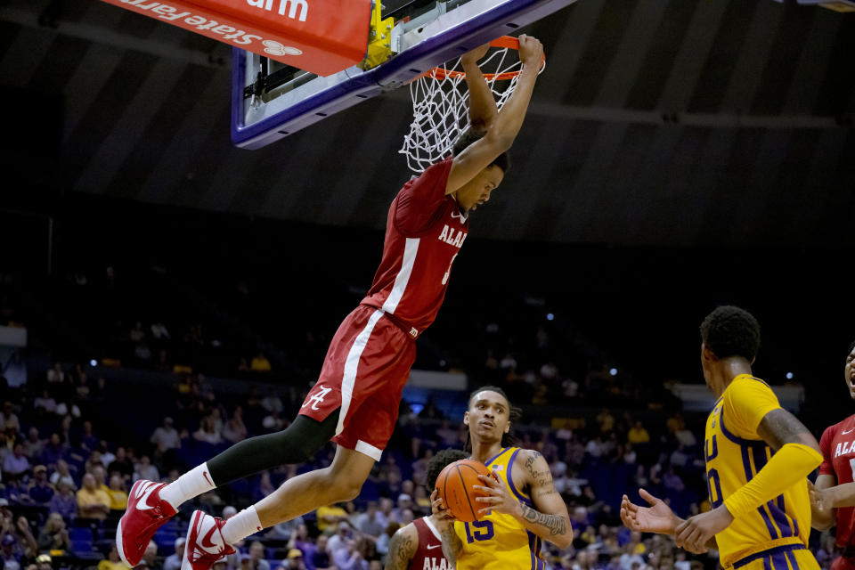 Alabama guard Rylan Griffen (3) dunks against LSU forward Tyrell Ward (15) during the second half of an NCAA college basketball game in Baton Rouge, La., Saturday, Feb. 10, 2024. (AP Photo/Matthew Hinton)